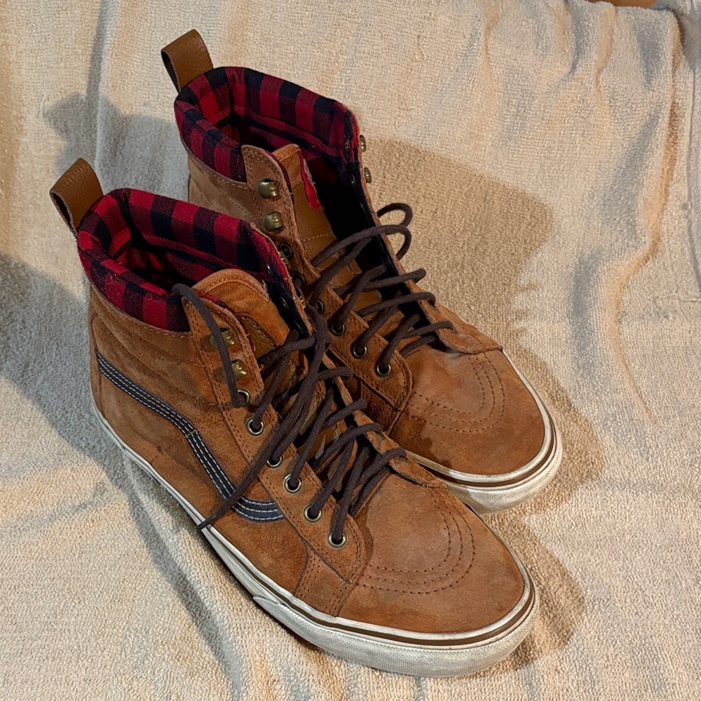 Vans Brown suede High-Top Sneakers with Red Accents.